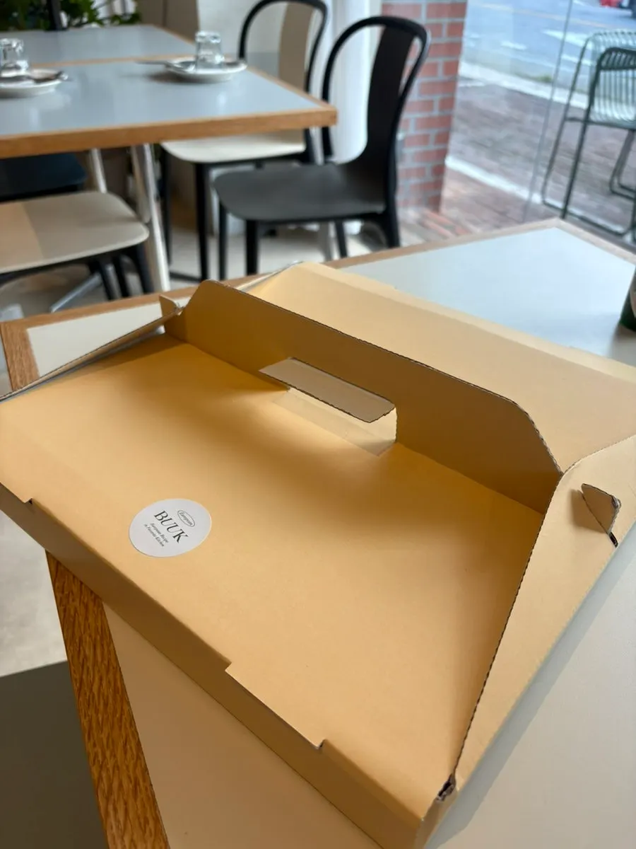 Takeaway box of leftover pizza