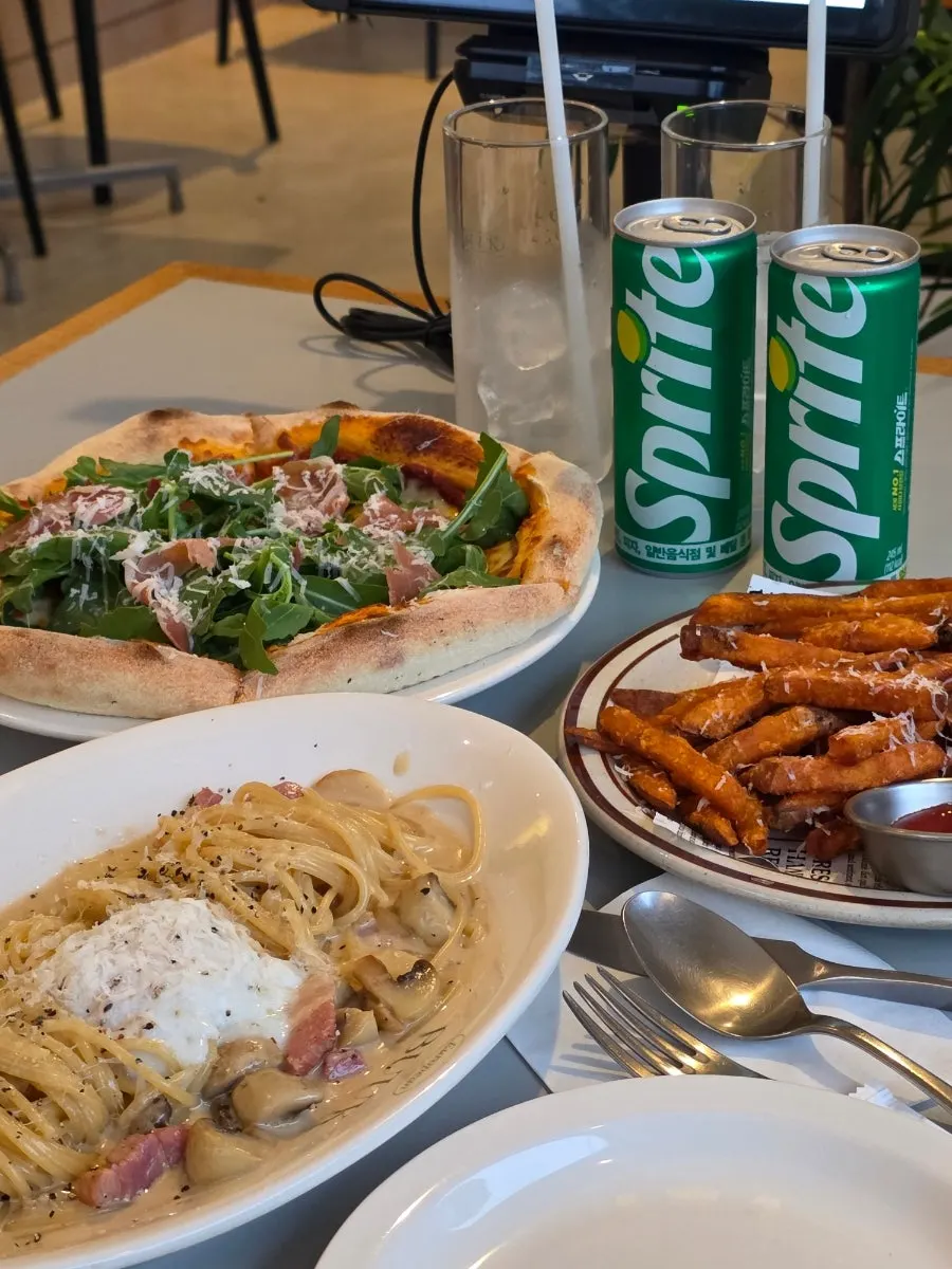 Western dishes laid out on the table at Bueokgan Suwan Branch