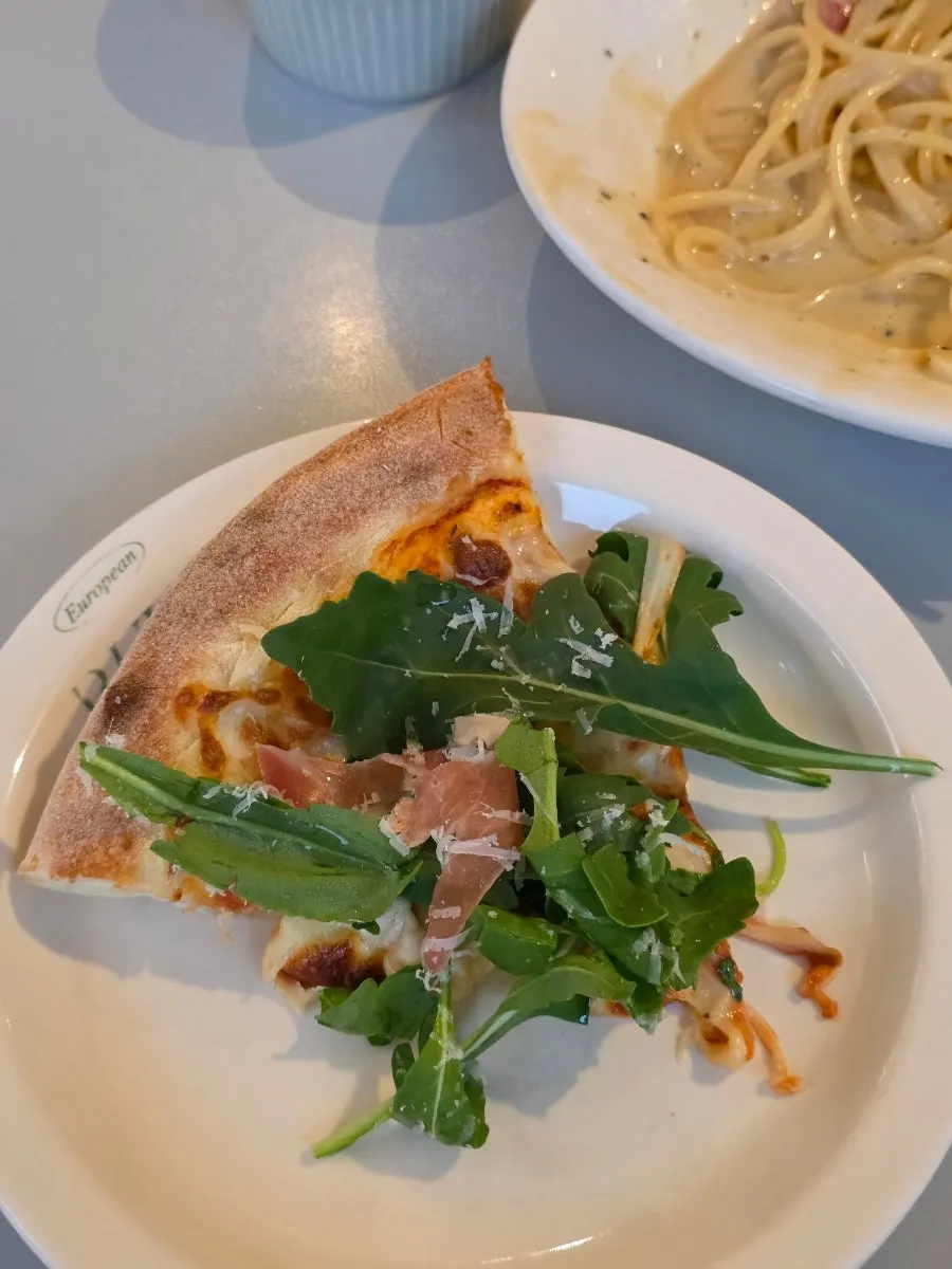 Arugula pizza drizzled with honey
