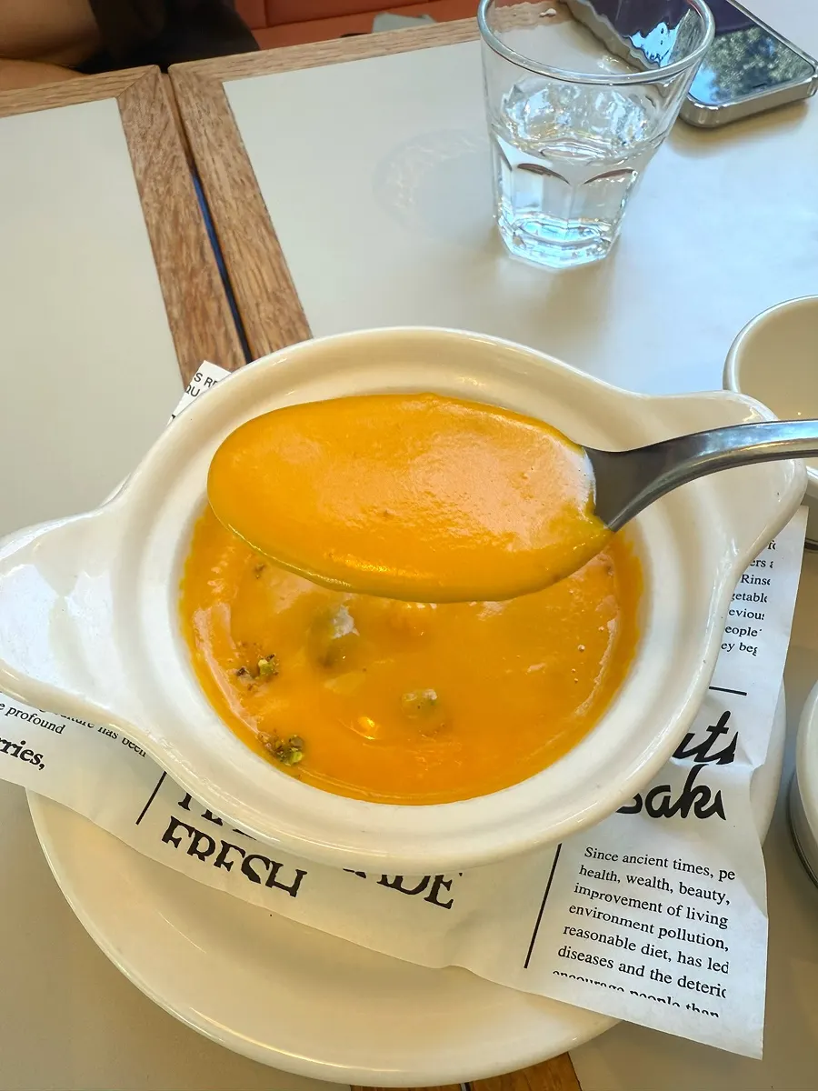 A spoonful of creamy pumpkin soup