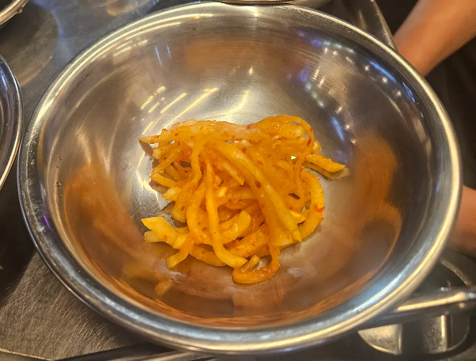 Close-up of the side dish plates at Bueongi Maeul