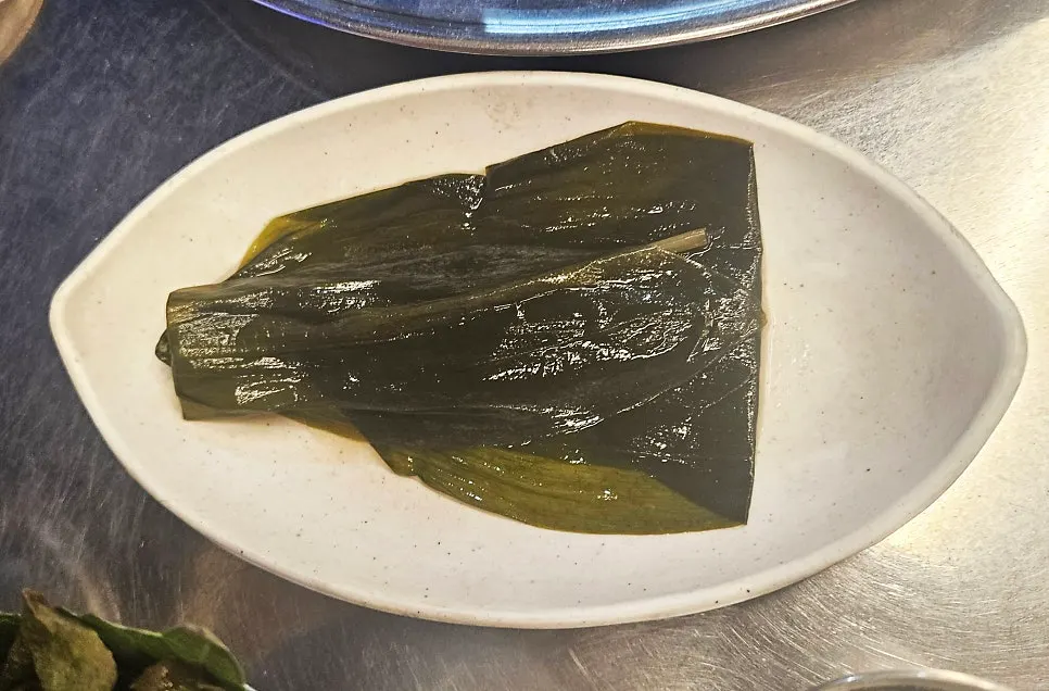 Sweet and tangy scallion salad served on a small plate