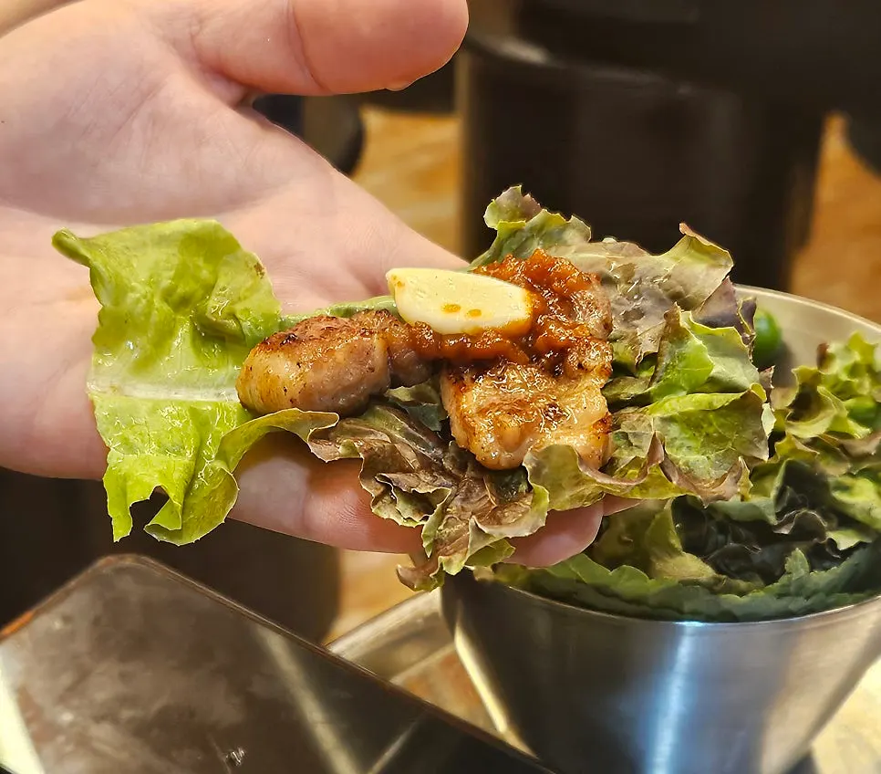 A tender piece of pork ribs cut with scissors