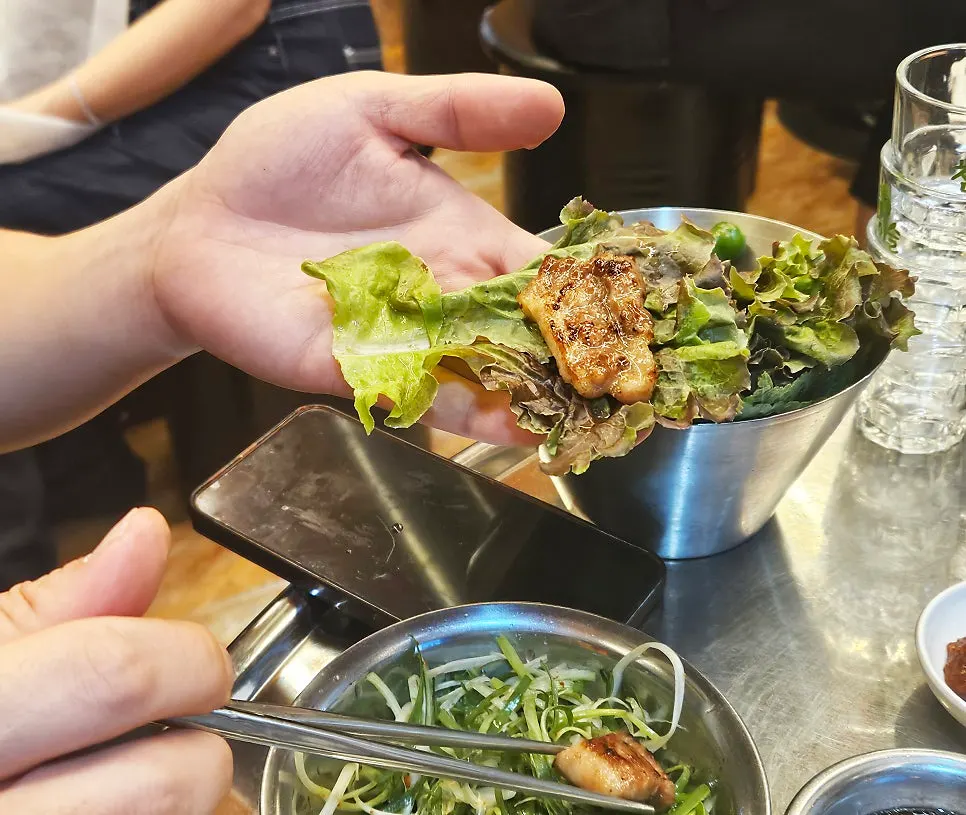 Raw garlic dipped in ssamjang, ready for the wrap