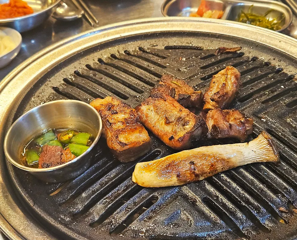 Remaining pork ribs and side dishes on the grill