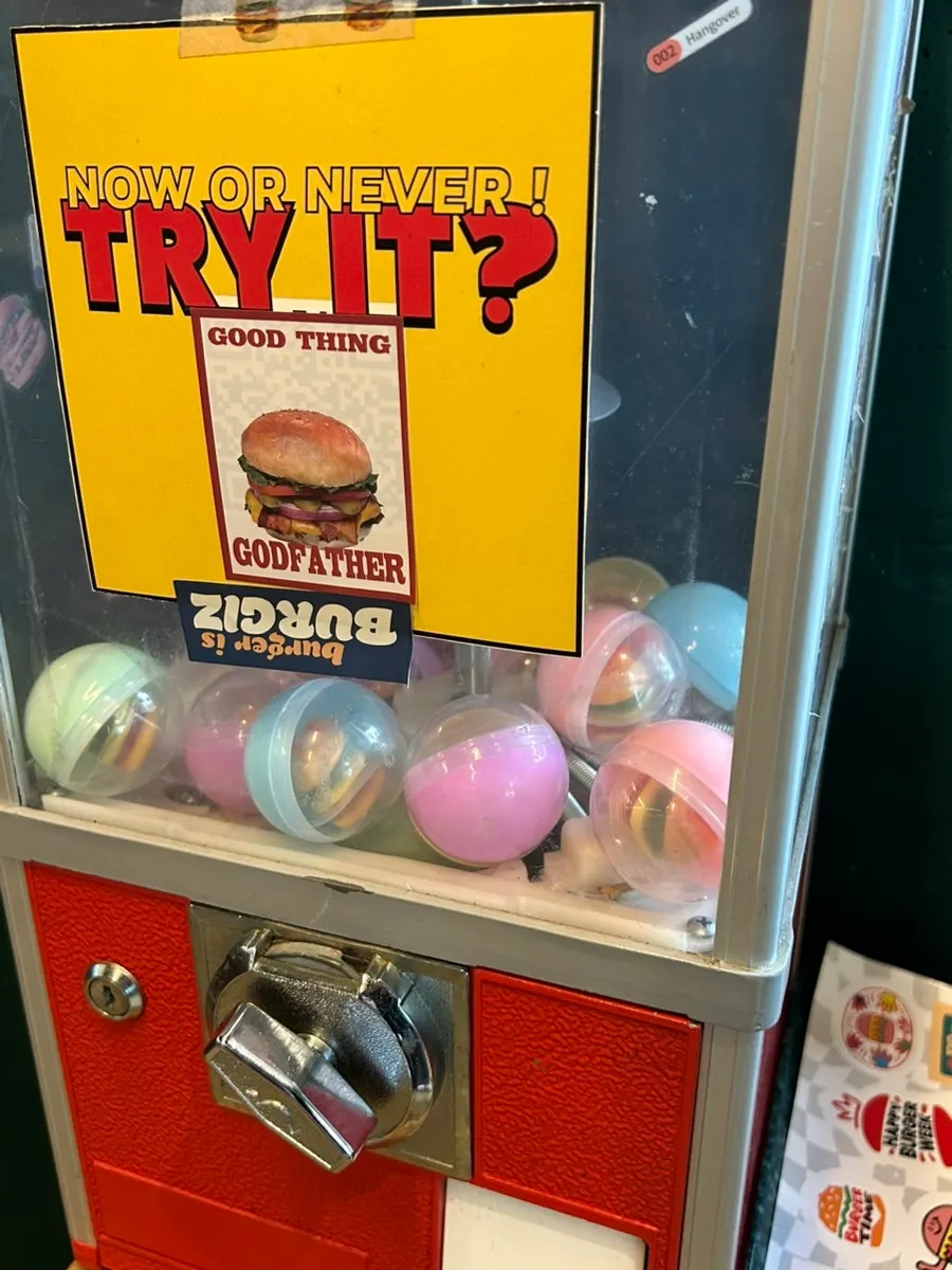 Store display shelf with free stickers and merch