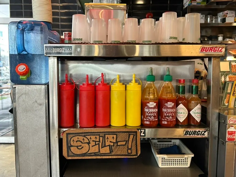Self-serve sauce and utensil station