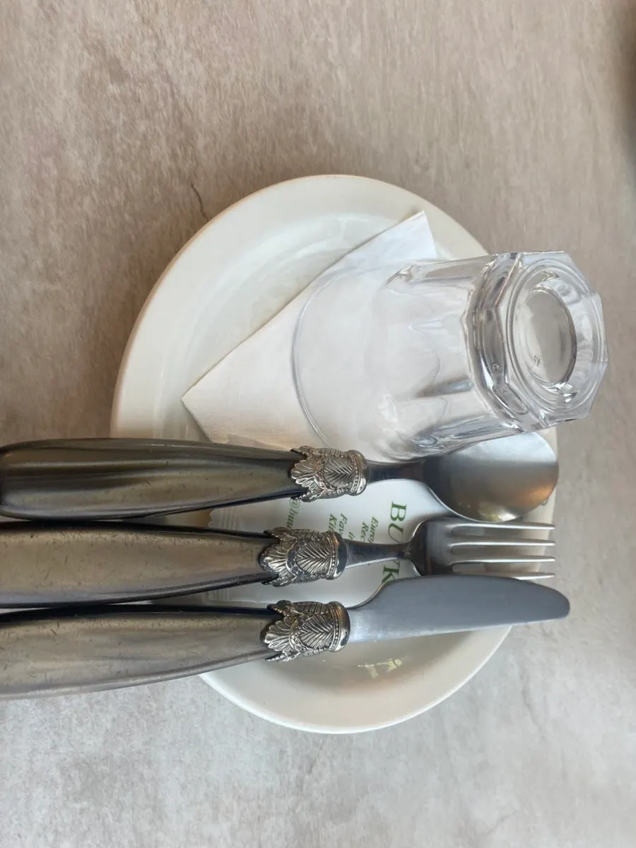 A spoonful of risotto with cream sauce mixed through