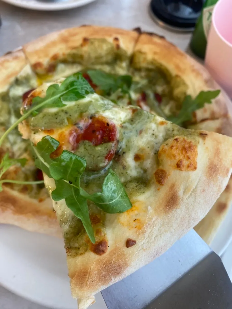 Close-up of pizza topped with basil