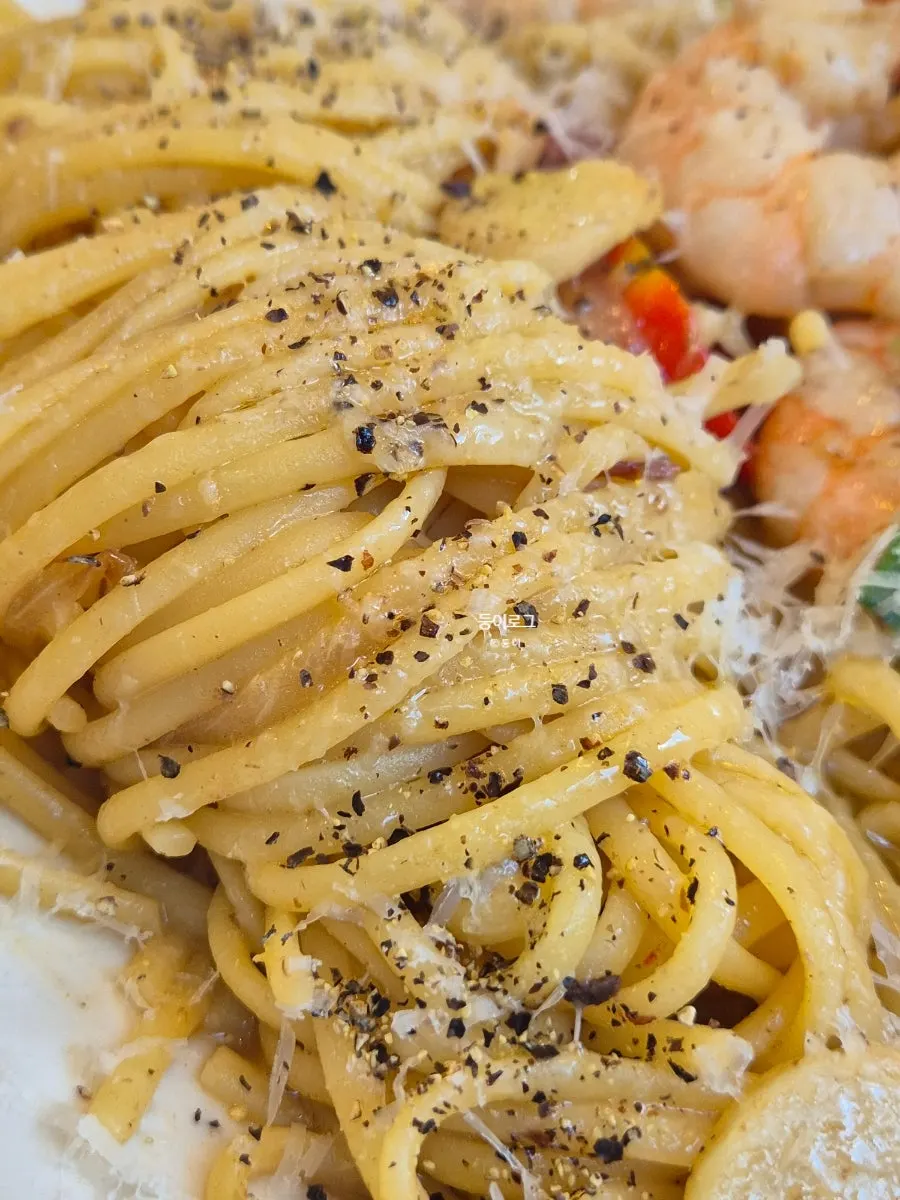 Side view of the shrimp anchovy oil pasta plate
