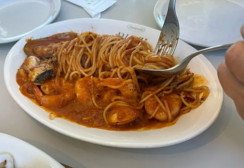 Close-up of the rich tomato sauce seafood pasta