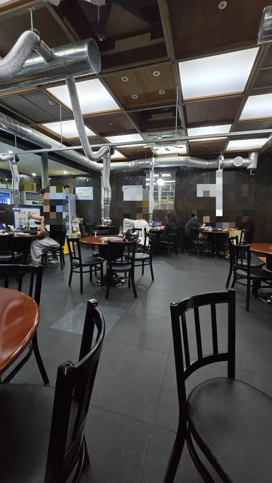 Dining hall with generously spaced round tables