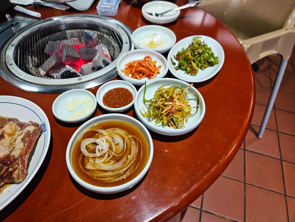 Banchan spread including scallion salad and radish salad