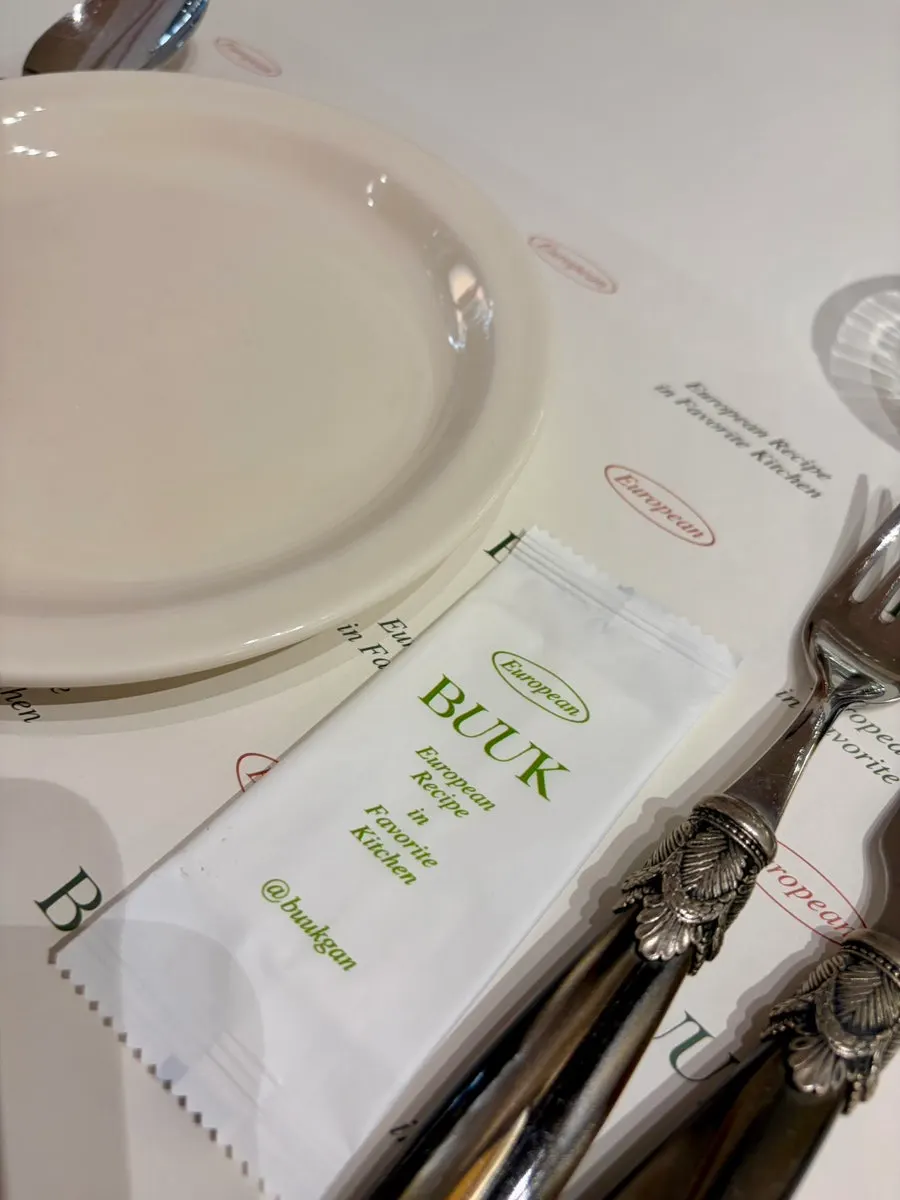 A corner of the restaurant with a corkage-free sign