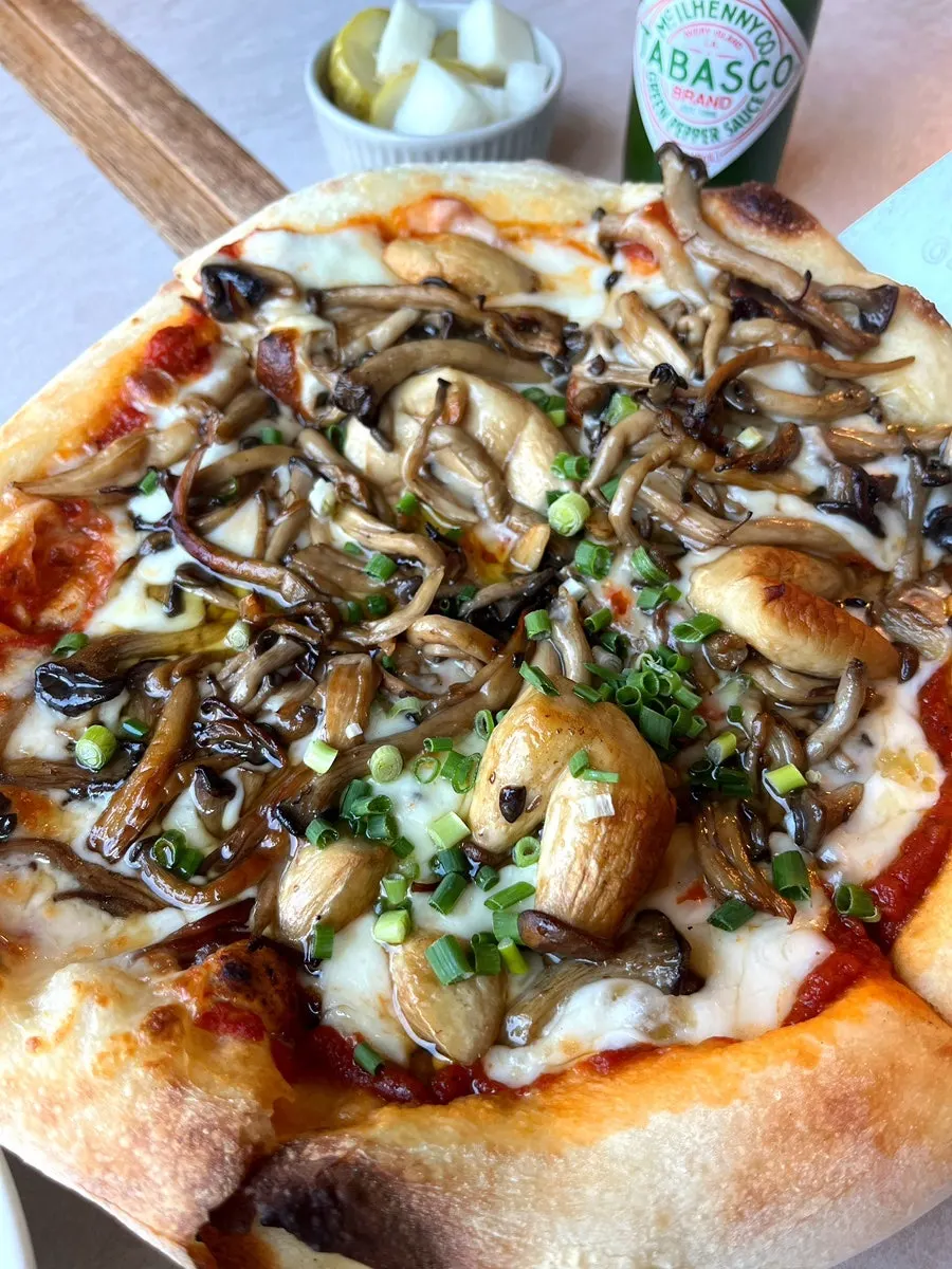 Tabasco sauce served alongside the pizza