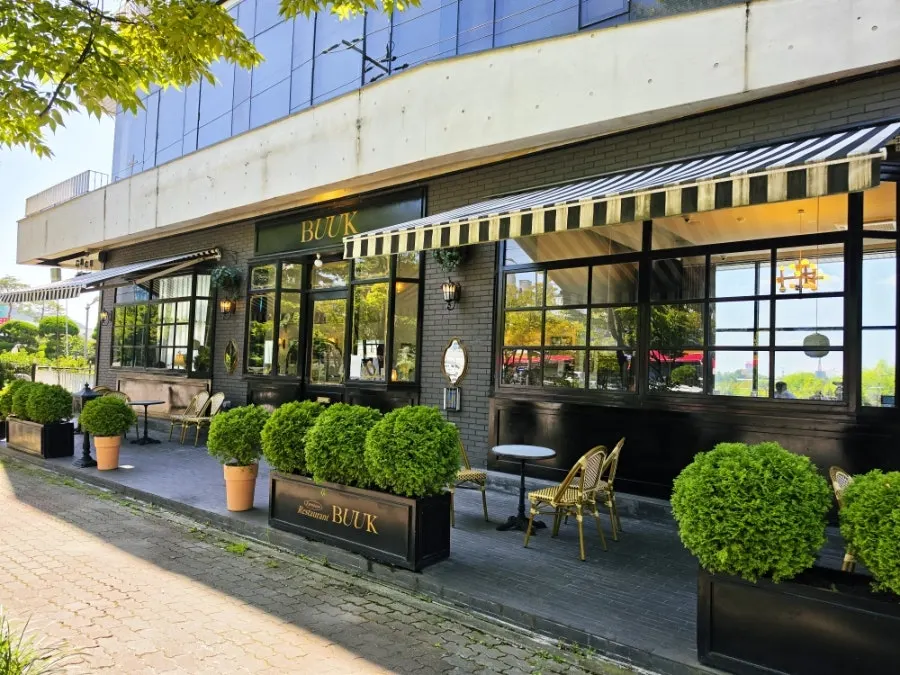 Exterior of Bueokgan Sangmu Branch, resembling a foreign café