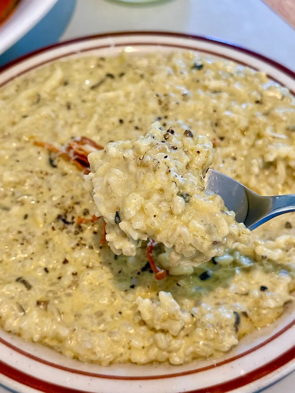 Abalone cream risotto topped with fried enoki mushroom