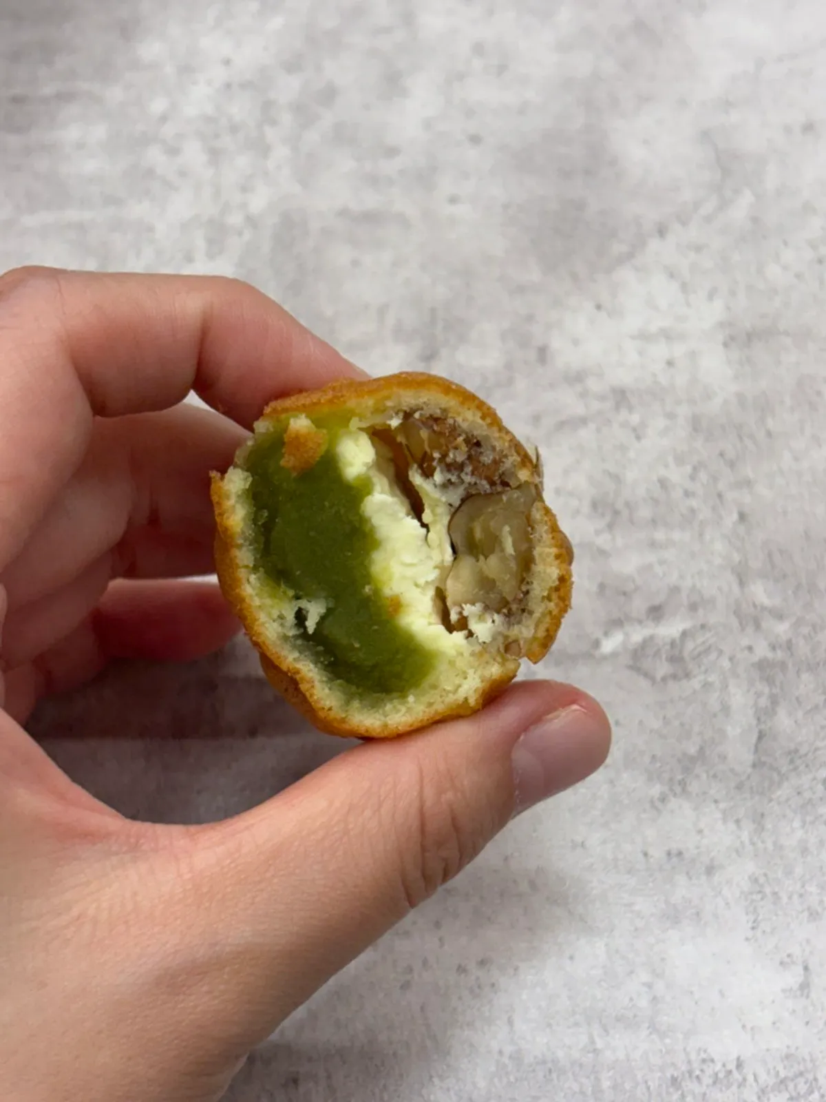 Cross-section of a low-sugar red bean walnut pastry packed with filling