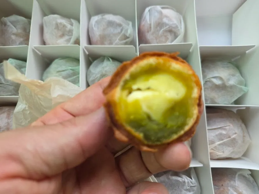 Cross-section of a rice-dough walnut pastry packed with filling