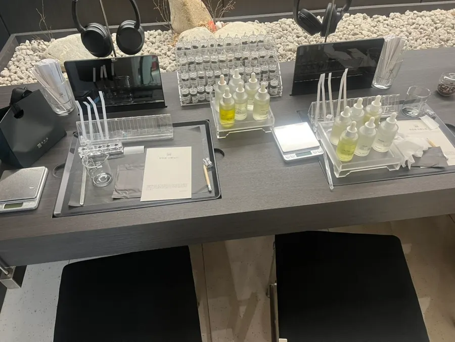 Adding fragrance into a beaker on the scale