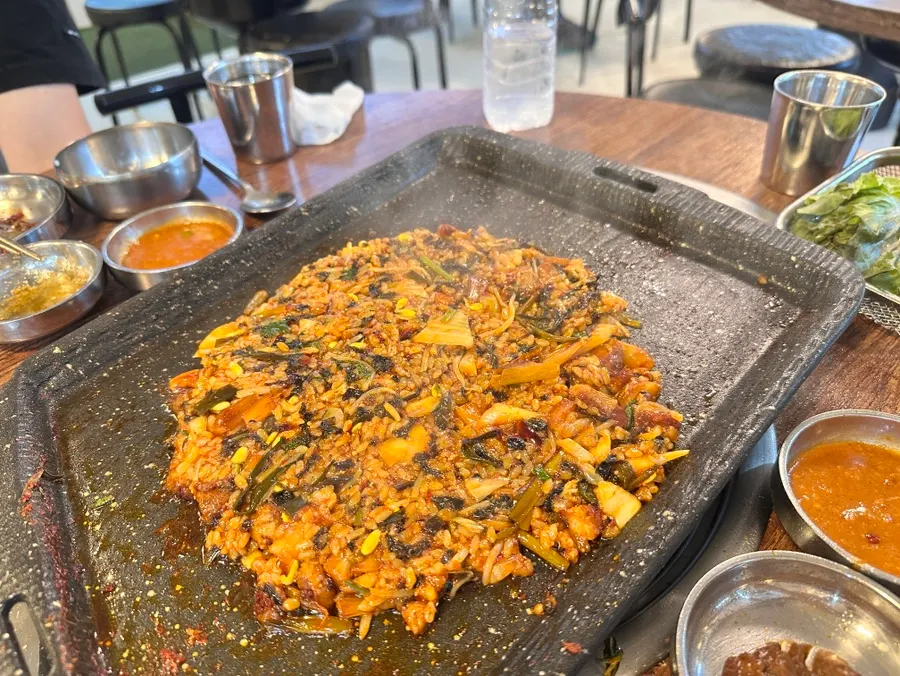 Fried rice pressed onto the grill before eating