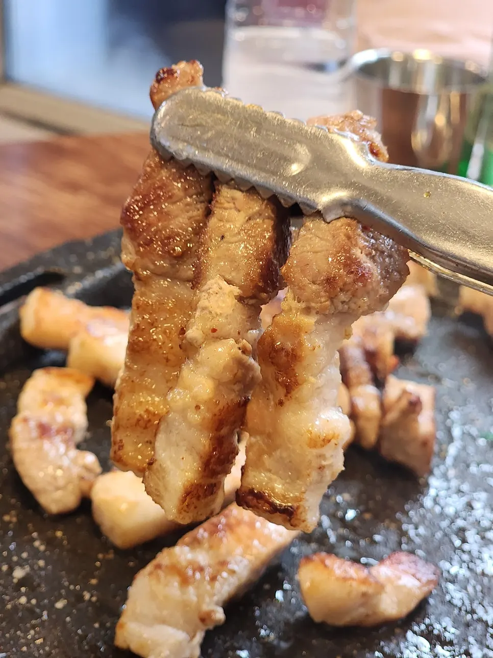 Thick whole pork belly on the grill