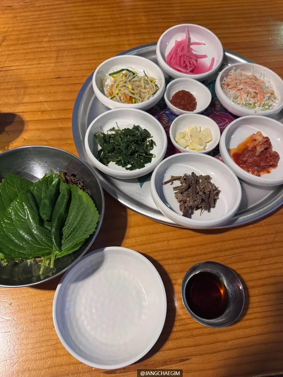 A tray of basic side dishes and wrap greens