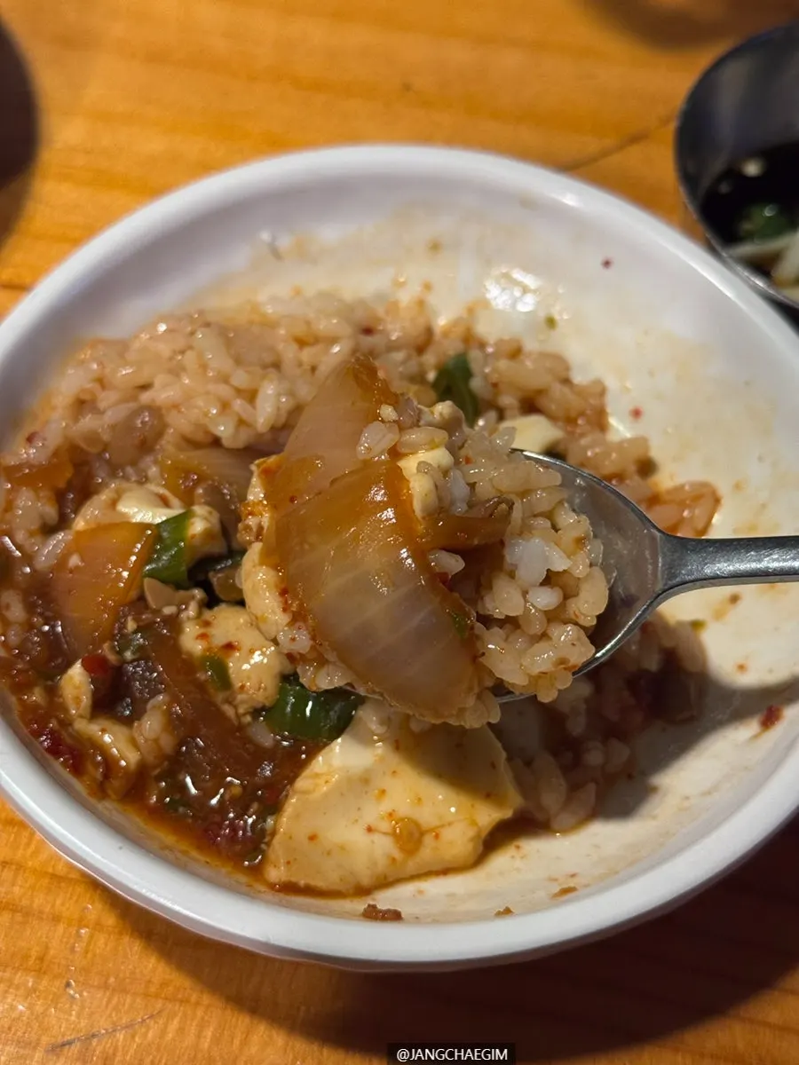 A tightly packed mound of rice with grandma-style doenjang jjigae