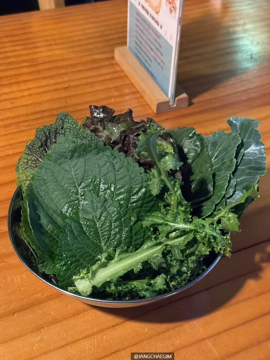 An extra plate of wrap greens from the self-serve bar