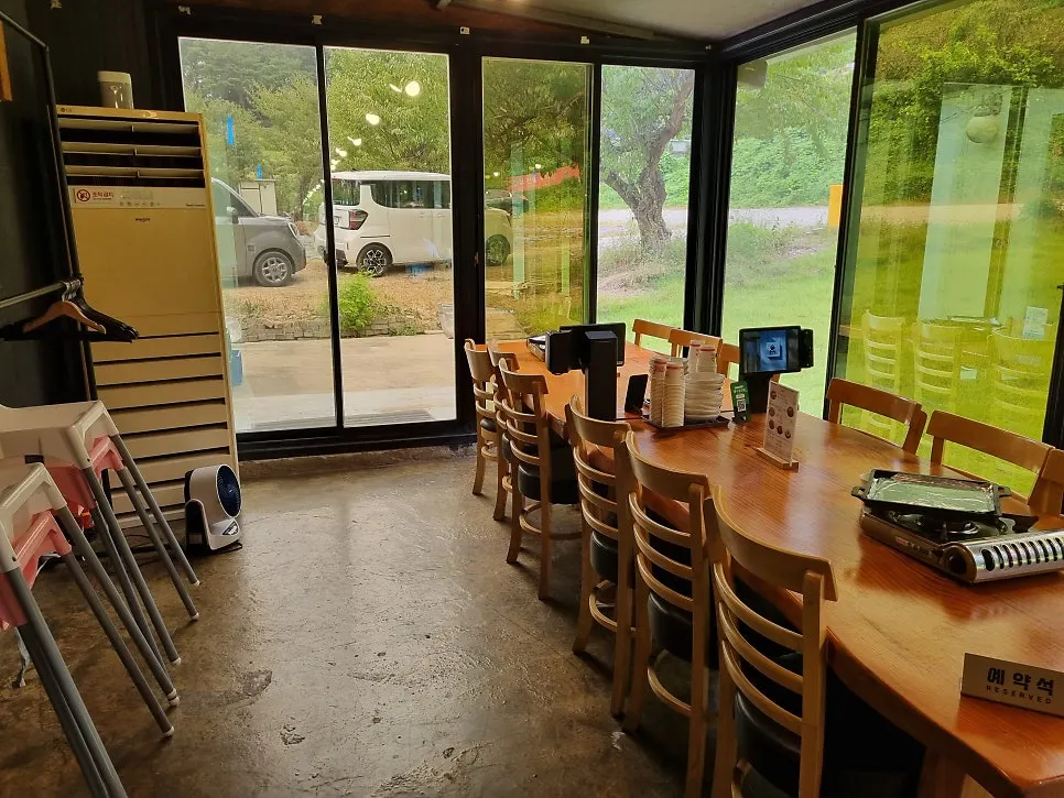 The spacious wood-toned dining hall at Bulhyangjip Mulwang Lake Main Branch