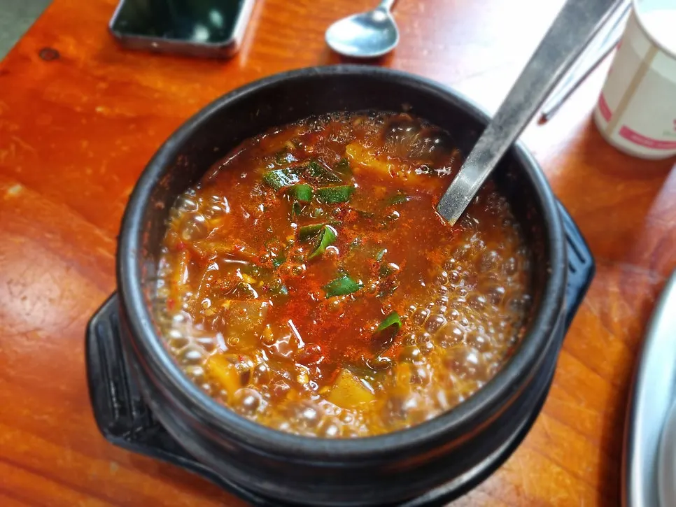A stone pot of farmhouse-style doenjang jjigae