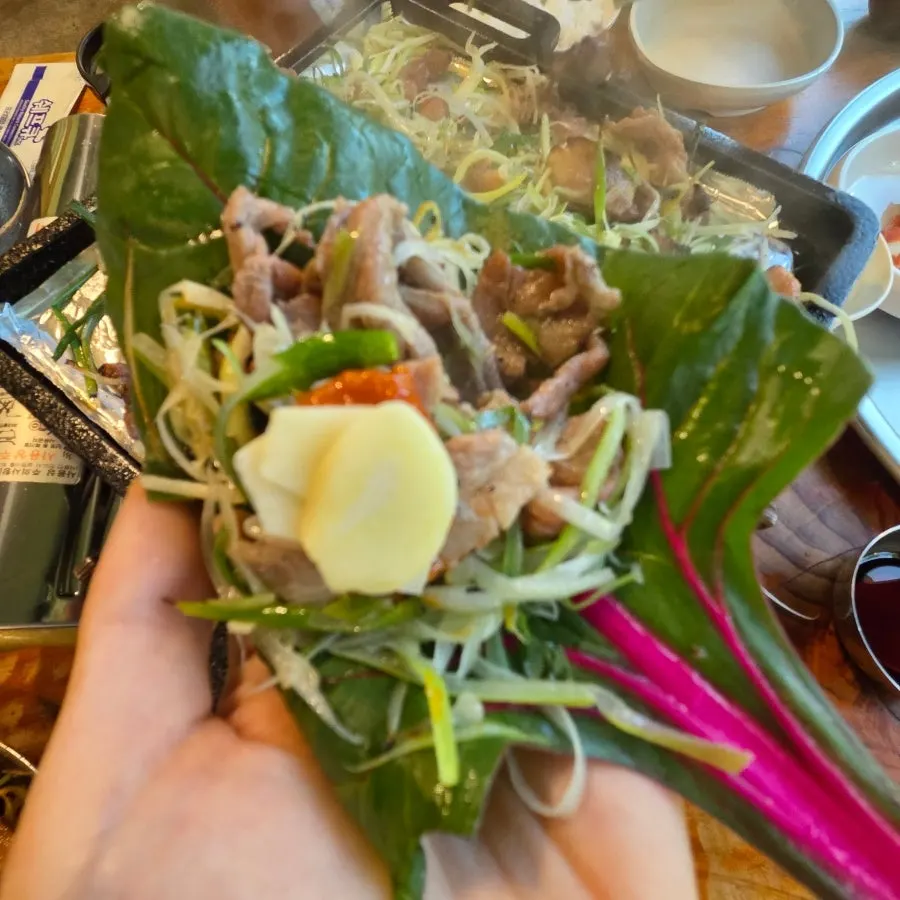 Charcoal scallion pancake bulgogi wrapped in leafy greens