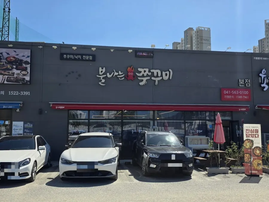 Spacious parking area in front of the building