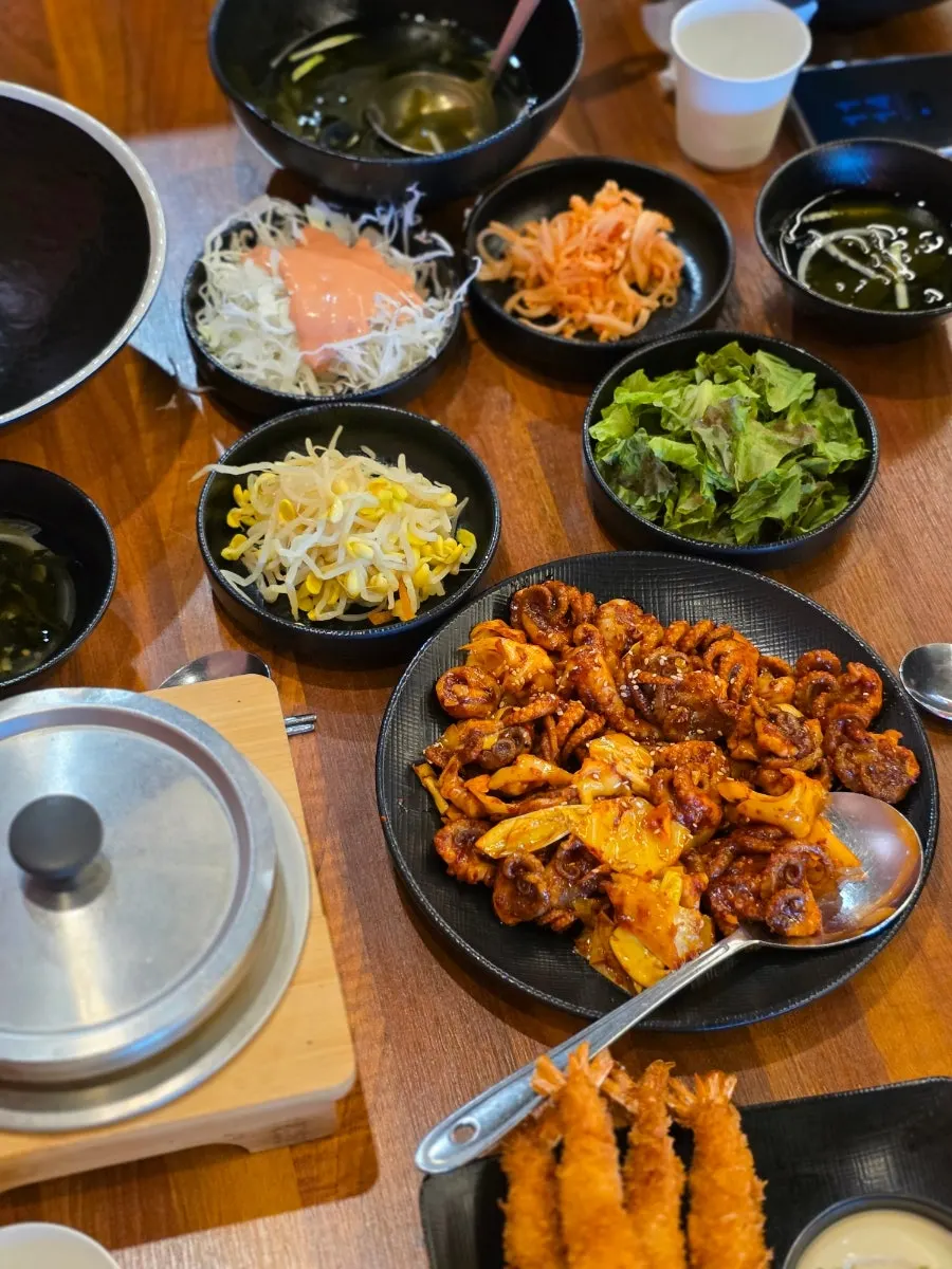 Full lunch set spread of jjukkumi stir-fry, pot rice, and shrimp tempura