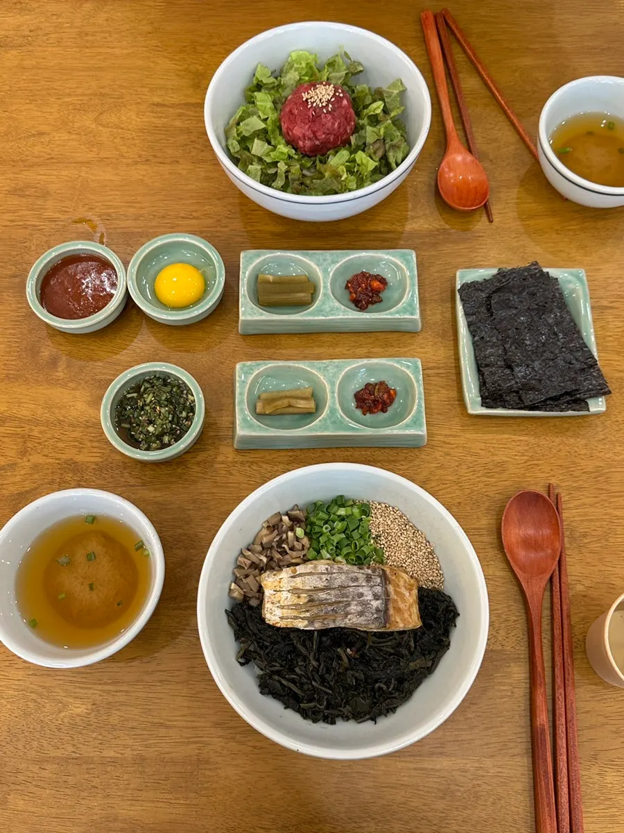 Table setting with chive soy sauce, egg, and doenjang soup