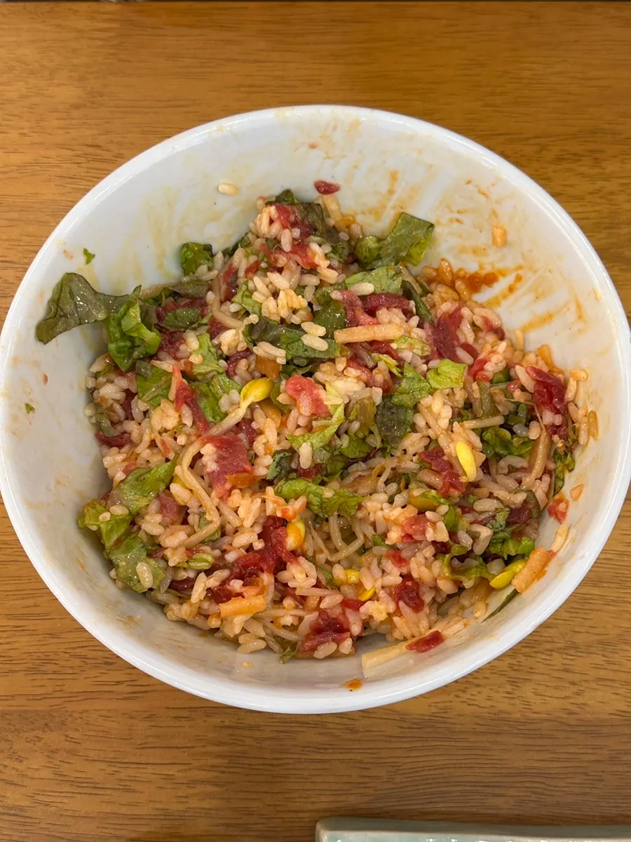Yukhoe bibimbap generously topped with raw beef and lettuce