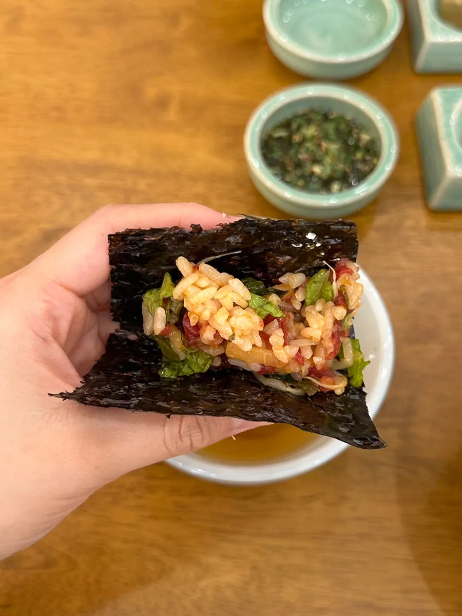 Yukhoe bibimbap wrapped in gopchang gim