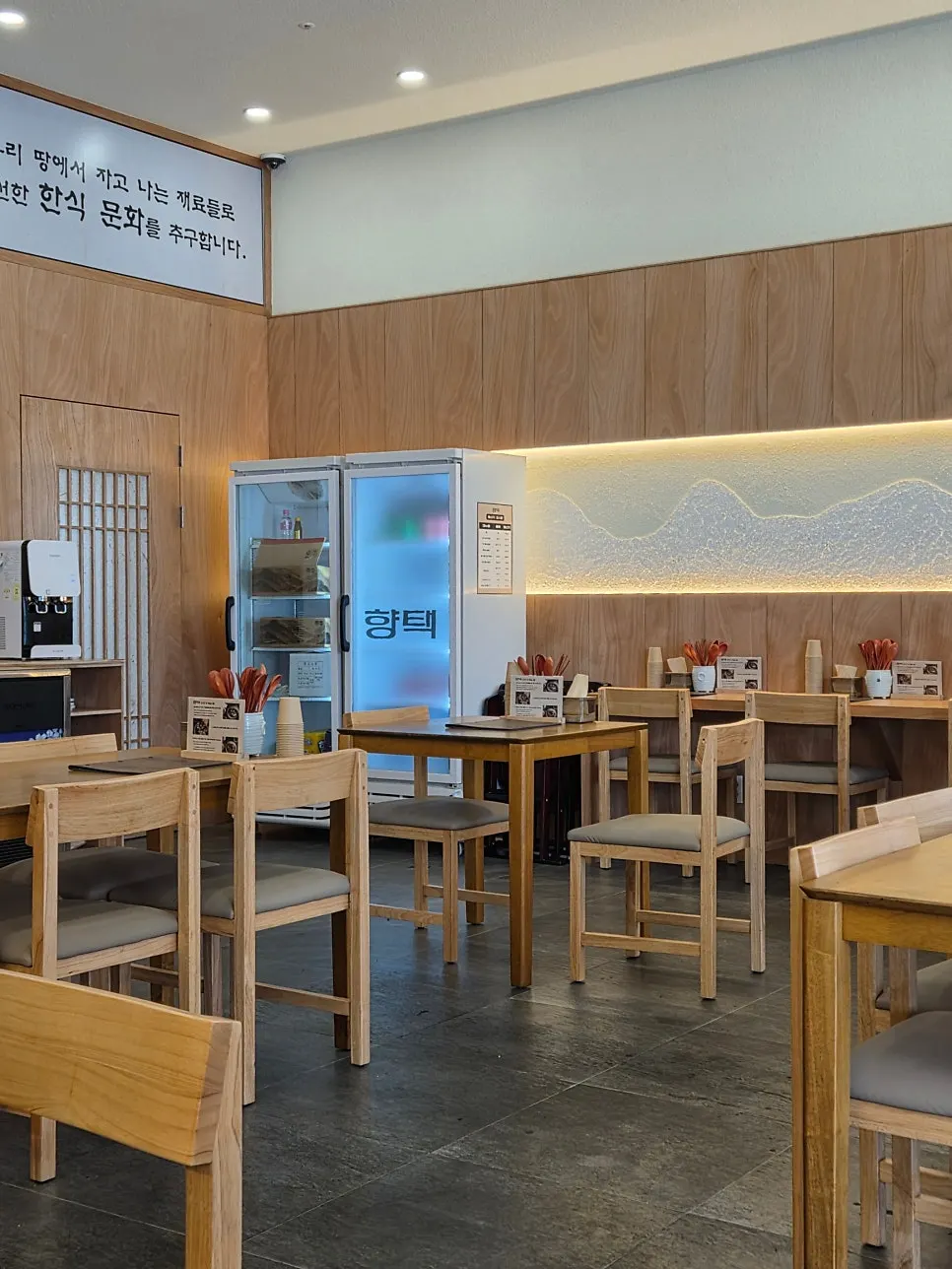 Table seating at Hyangtaek photographed after the crowd cleared