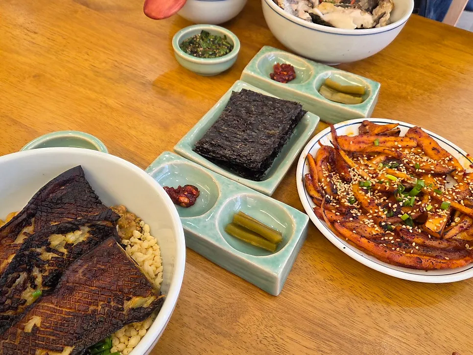 Hyangtaek's bowls of Korean food alongside side dishes