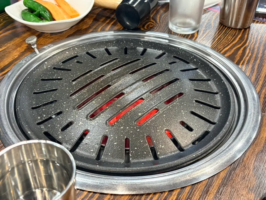 Grill and side dish table setting ready for cooking