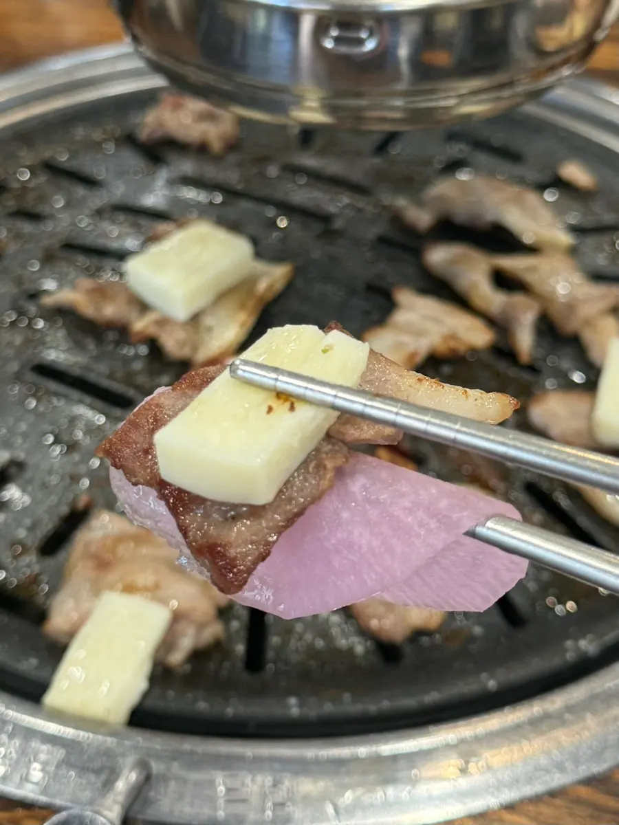 Kkodeulsal and cheese combo dipped in condensed milk
