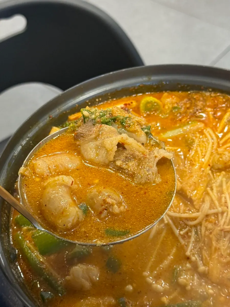 Beef tripe hot pot with glass noodles and enoki mushrooms