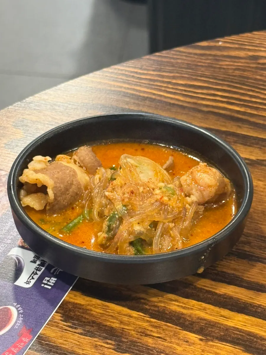 Spicy broth of the beef tripe hot pot bubbling away