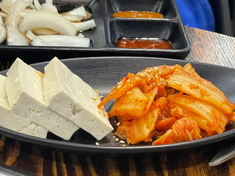 BBQ restaurant side dishes with tofu kimchi