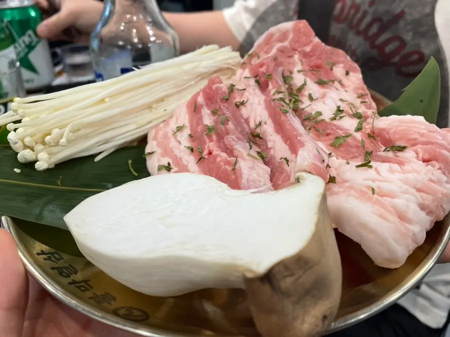 Pork set with raw pork belly and raw makchang laid out