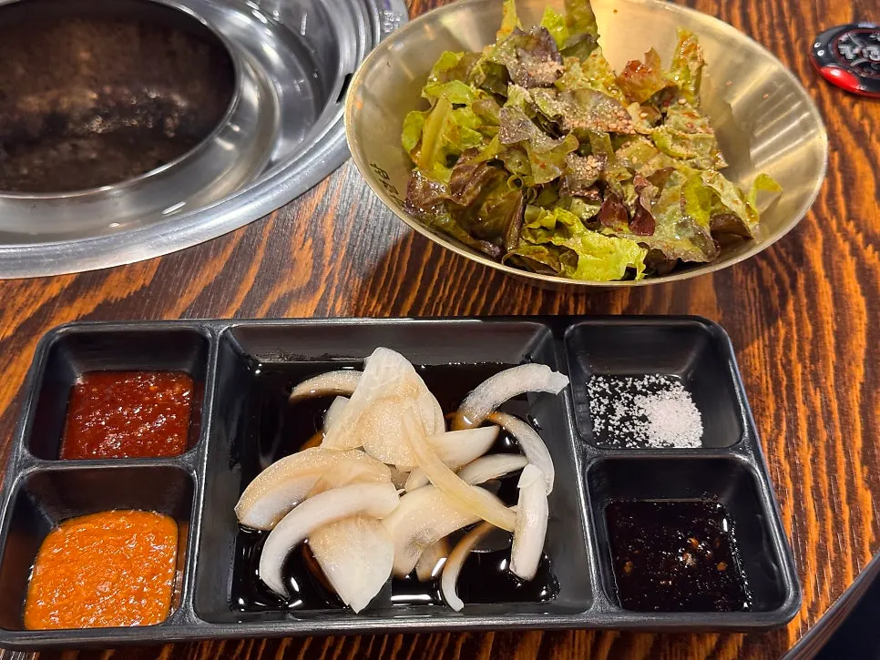 Table setting with basic side dishes and lettuce wraps