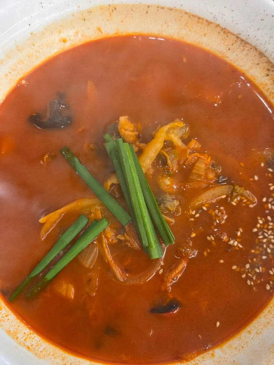 Jjamppong rice broth with cockles and vegetables