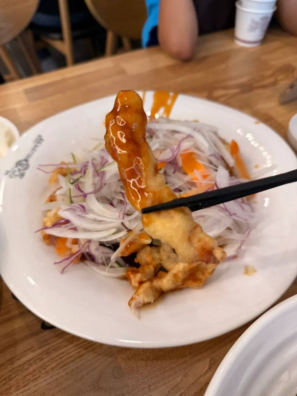 A piece of sweet-and-sour pork covered in sauce