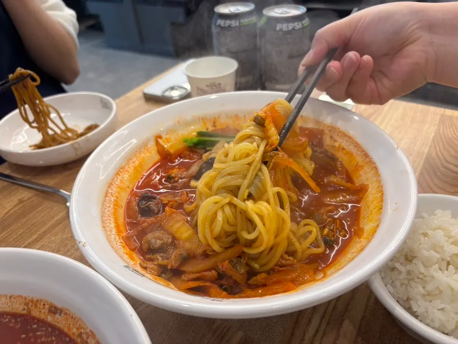 Close-up of the red broth of cockle jjamppong