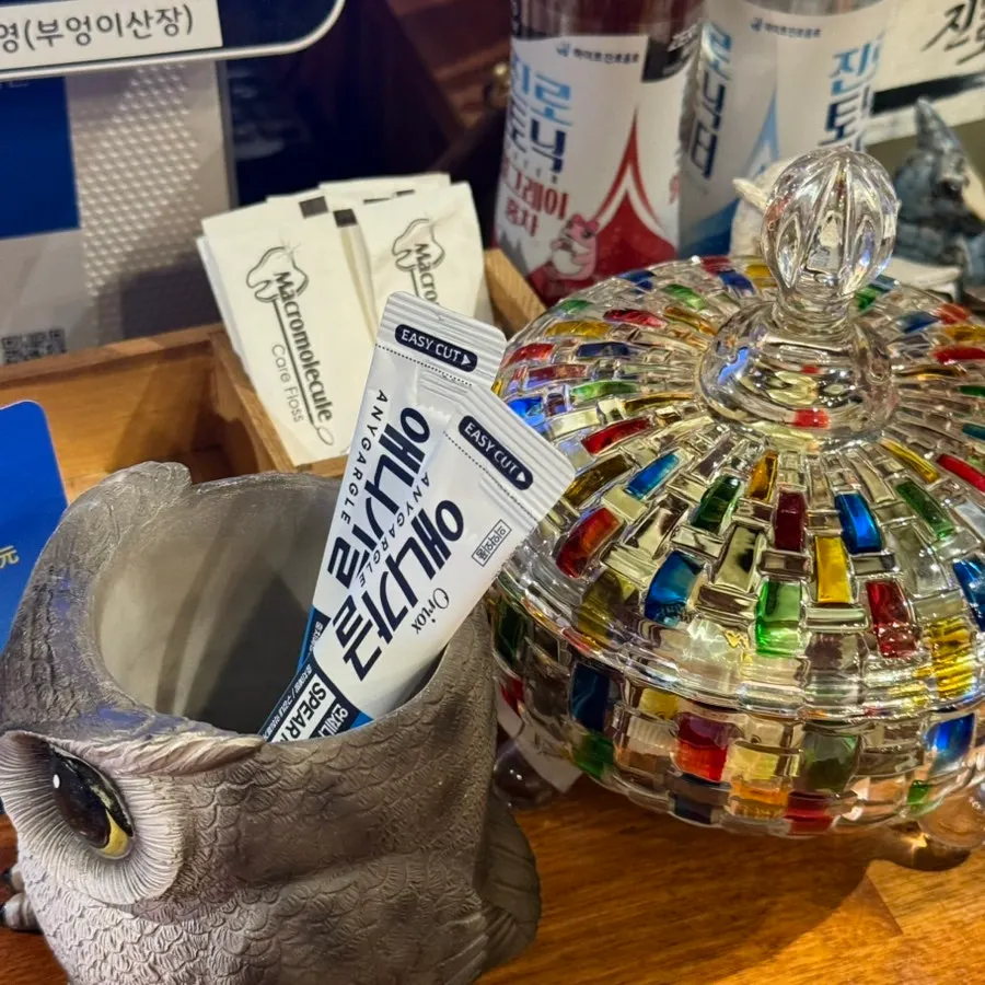 Candy, floss, and mouthwash set out at the counter